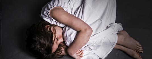 Girl with a white dress sleeping on the floor