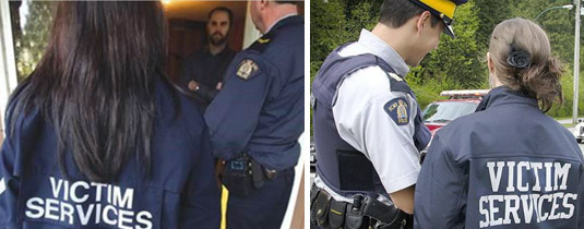 Victim Services Worker and Police Officer speaking with civilian at doorway